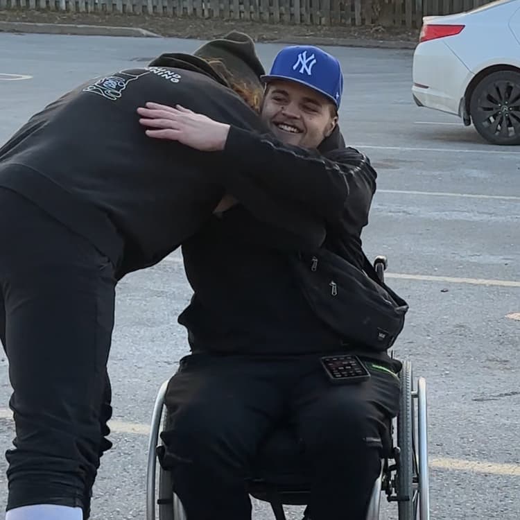 HTGR survivor embracing a supporter